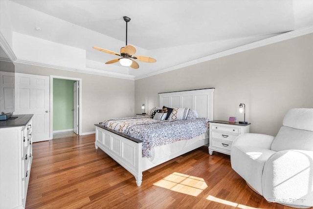 25909 S Woodrush Way, Channahon, IL 60410 - bedroom featuring dark wood finished floors, crown molding, a tray ceiling, and a ceiling fan