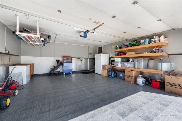 25909 S Woodrush Way, Channahon, IL 60410 - garage featuring freestanding refrigerator and a garage door opener
