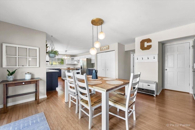 25909 S Woodrush Way, Channahon, IL 60410 - dining space featuring light wood-style floors and baseboards