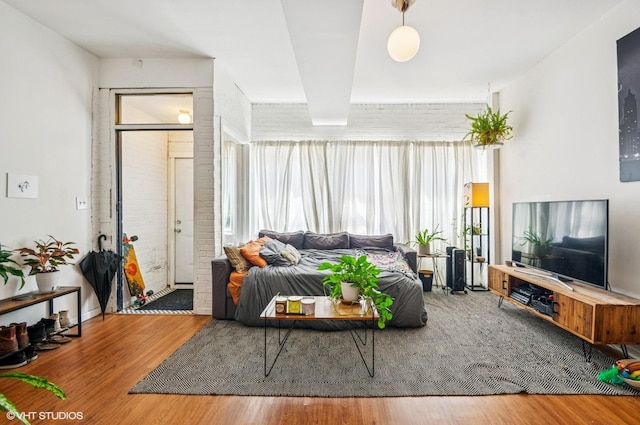 1510 W Cullerton St, Chicago, IL 60608 - living area with wood finished floors and brick wall