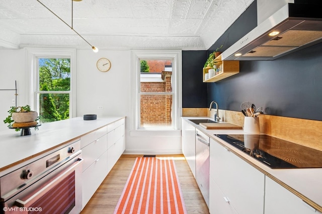 1510 W Cullerton St, Chicago, IL 60608 - kitchen with ventilation hood, appliances with stainless steel finishes, and white cabinetry
