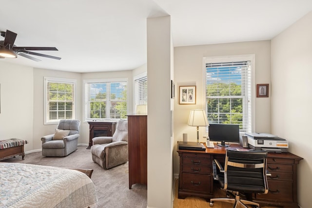 940 Augusta Way Unit 315, Highland Park, IL 60035 - bedroom with an office area, light carpet, and a ceiling fan