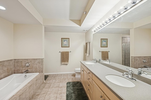 940 Augusta Way Unit 315, Highland Park, IL 60035 - full bathroom featuring a garden tub, double vanity, tile patterned flooring, and a tile shower