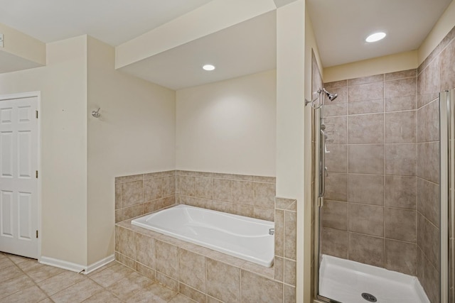 940 Augusta Way Unit 315, Highland Park, IL 60035 - bathroom with tile patterned flooring, a garden tub, a shower stall, and recessed lighting