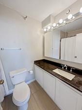10 E Ontario St Unit 3912, Chicago, IL 60611 - bathroom featuring vanity, curtained shower, and tile patterned floors