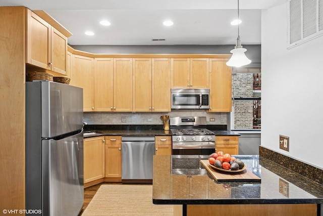 7639 N Greenview Ave Unit 1E, Chicago, IL 60626 - kitchen with appliances with stainless steel finishes, light brown cabinets, decorative backsplash, and recessed lighting