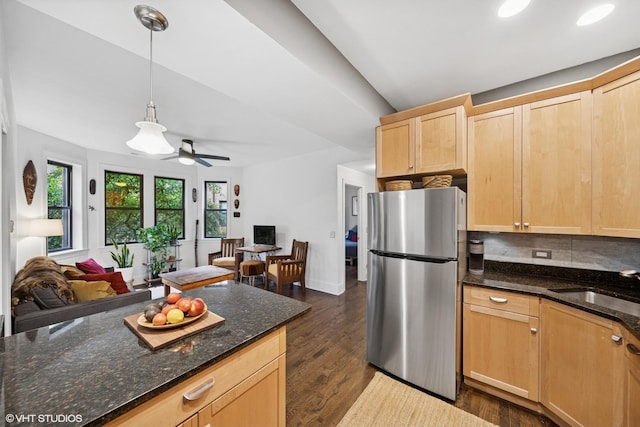 7639 N Greenview Ave Unit 1E, Chicago, IL 60626 - kitchen with freestanding refrigerator, light brown cabinetry, open floor plan, dark wood-style flooring, and dark stone counters