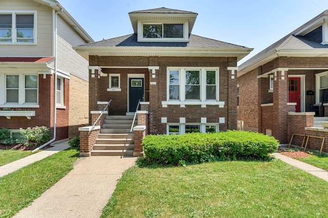 2407 S 60th Ct, Cicero, IL 60804 - bungalow-style home featuring a shingled roof, a front yard, covered porch, and brick siding