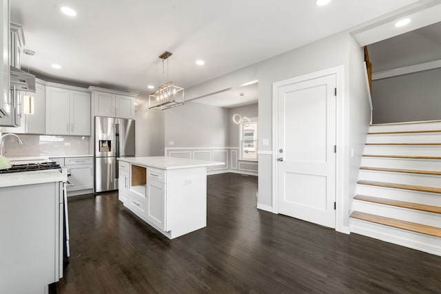 2407 S 60th Ct, Cicero, IL 60804 - kitchen featuring stainless steel fridge, light countertops, a center island, recessed lighting, and dark wood-style floors