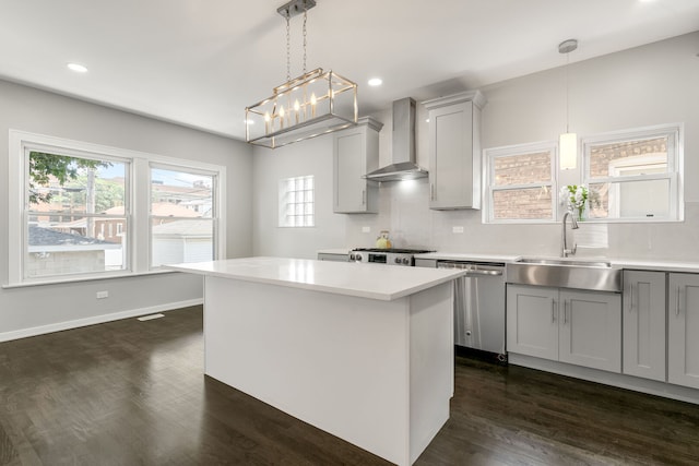 2407 S 60th Ct, Cicero, IL 60804 - kitchen featuring wall chimney exhaust hood, stainless steel dishwasher, gray cabinets, light countertops, and dark wood-style flooring