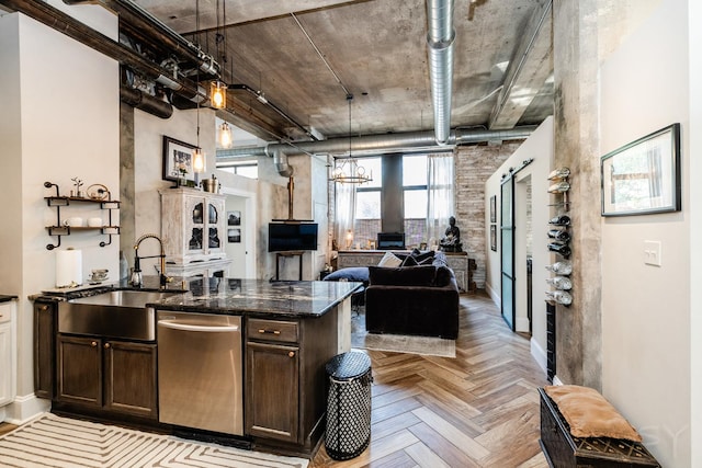 1820 N Spaulding Ave Unit 102, Chicago, IL 60647 - kitchen featuring dishwasher, dark brown cabinets, open floor plan, dark stone counters, and pendant lighting