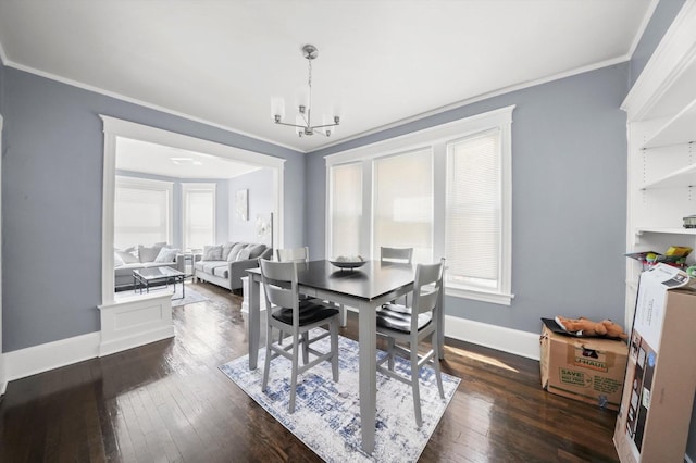 7144 S Champlain Ave, Chicago, IL 60619 - dining room with ornamental molding, a chandelier, and dark wood finished floors