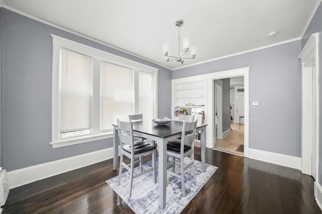 7144 S Champlain Ave, Chicago, IL 60619 - dining room featuring crown molding, a chandelier, and wood finished floors