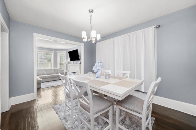 7144 S Champlain Ave, Chicago, IL 60619 - dining space with a chandelier and wood finished floors