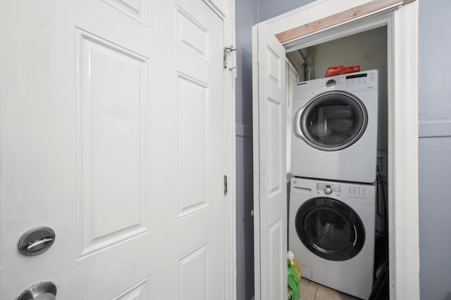 7144 S Champlain Ave, Chicago, IL 60619 - laundry room featuring stacked washer / dryer and light tile patterned floors