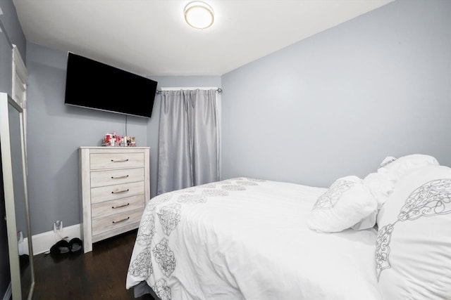 7144 S Champlain Ave, Chicago, IL 60619 - bedroom with dark wood-style floors and baseboards