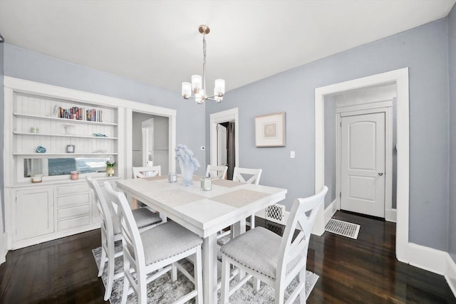 7144 S Champlain Ave, Chicago, IL 60619 - dining space featuring a chandelier and dark wood-style flooring