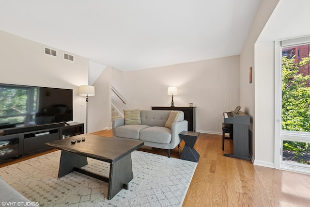 3843 Appian Way, Glenview, IL 60025 - living room with plenty of natural light, wood finished floors, and stairs