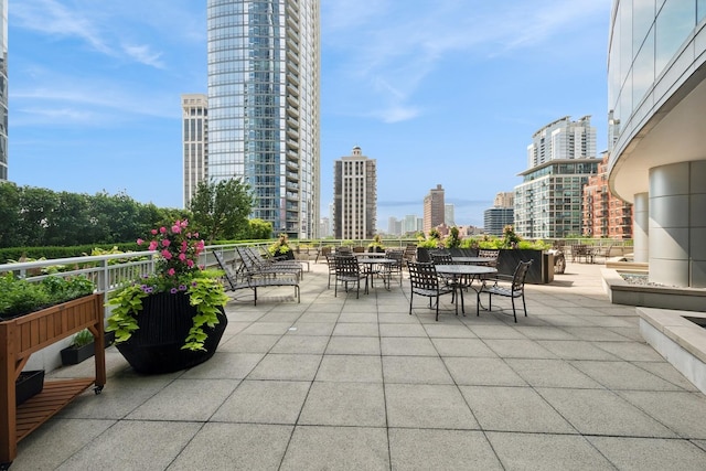 1201 S Prairie Ave Unit 5004, Chicago, IL 60605 - view of patio / terrace featuring a view of skyline and outdoor dining space