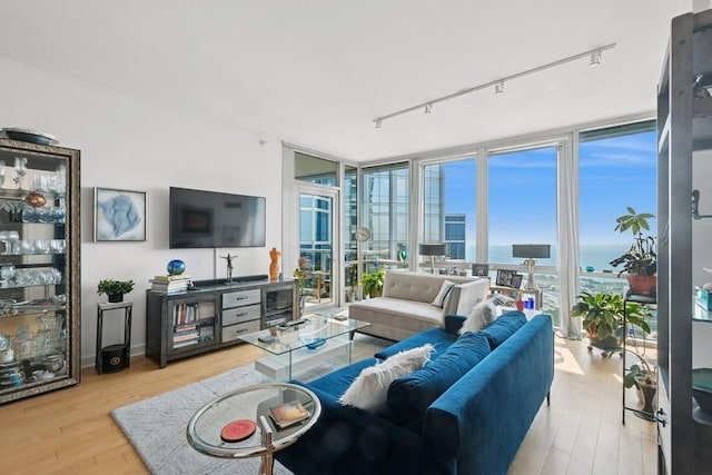 1201 S Prairie Ave Unit 5004, Chicago, IL 60605 - living area featuring a wall of windows, track lighting, wood finished floors, and wine cooler