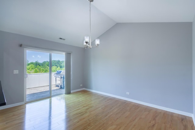 2746 Acorn Ct Unit 2746, West Dundee, IL 60118 - spare room with light wood finished floors, a chandelier, and vaulted ceiling