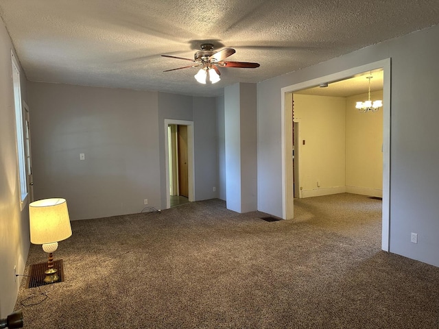 12851 Argo Fay Rd, Thomson, IL 61285 - spare room featuring a ceiling fan, carpet flooring, a chandelier, and a textured ceiling