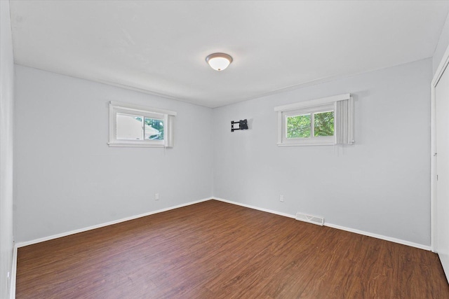 1807 Broadmoor Dr, Champaign, IL 61821 - empty room with wood finished floors and baseboards