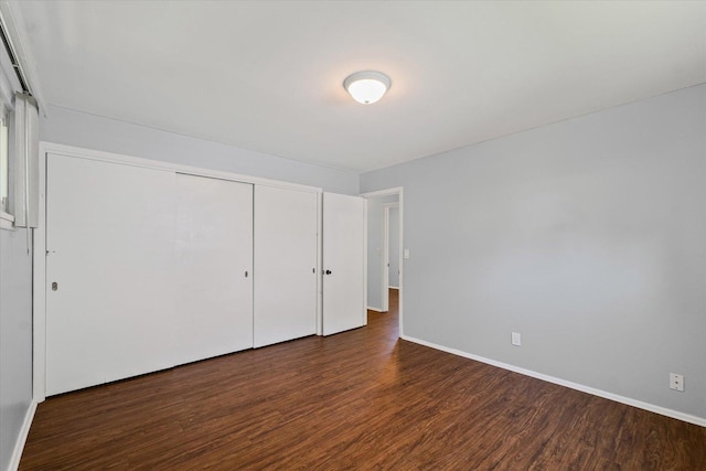 1807 Broadmoor Dr, Champaign, IL 61821 - unfurnished bedroom featuring wood finished floors and a closet