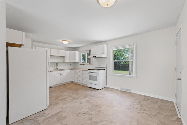 1807 Broadmoor Dr, Champaign, IL 61821 - kitchen featuring white appliances, under cabinet range hood, white cabinetry, and light countertops
