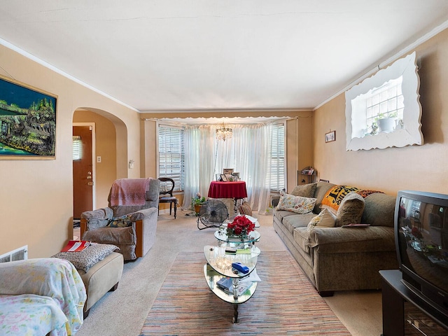 10458 S Forest Ave, Chicago, IL 60628 - living area with arched walkways, ornamental molding, and light carpet
