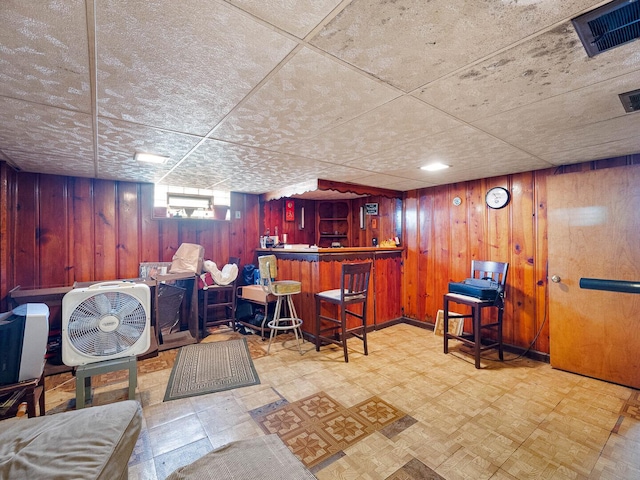 10458 S Forest Ave, Chicago, IL 60628 - indoor dry bar with tile patterned floors and wooden walls