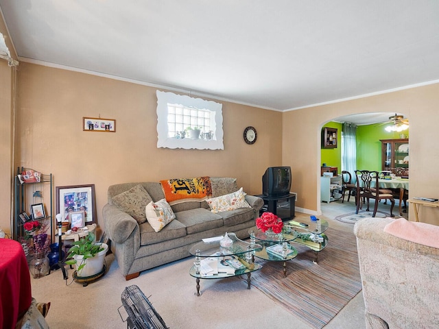 10458 S Forest Ave, Chicago, IL 60628 - living room with arched walkways, crown molding, a ceiling fan, and carpet flooring