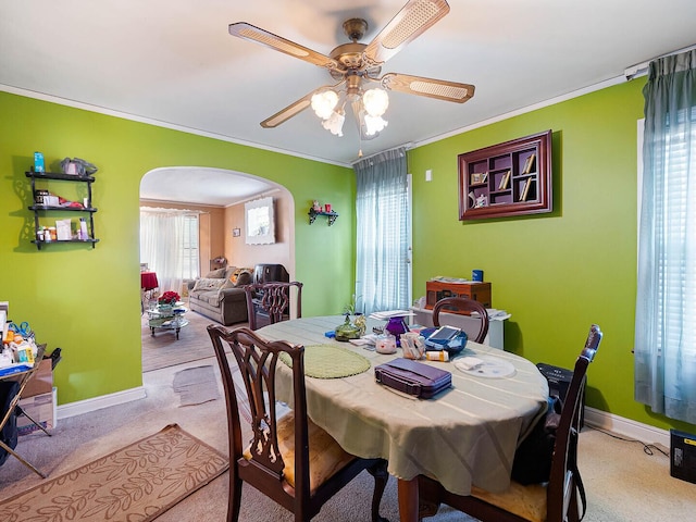 10458 S Forest Ave, Chicago, IL 60628 - dining room with arched walkways, ornamental molding, light carpet, and a ceiling fan