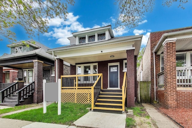 7716 S Rhodes Ave, Chicago, IL 60619 - view of front of property with covered porch and brick siding