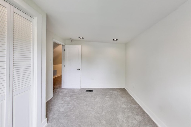 7716 S Rhodes Ave, Chicago, IL 60619 - unfurnished bedroom featuring carpet flooring, a closet, and recessed lighting