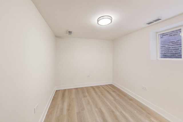 7716 S Rhodes Ave, Chicago, IL 60619 - spare room featuring light wood finished floors and baseboards