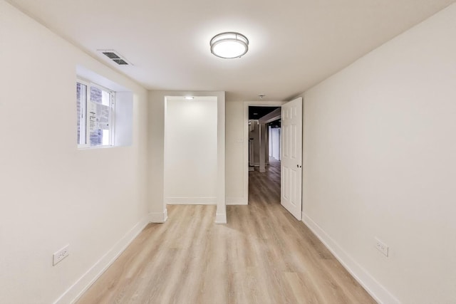 7716 S Rhodes Ave, Chicago, IL 60619 - unfurnished room featuring light wood-type flooring and baseboards