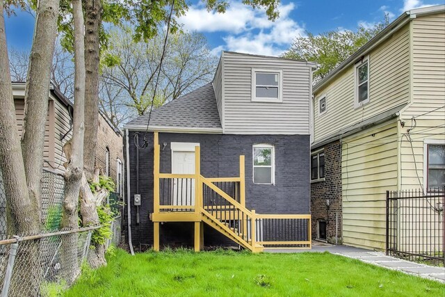 7716 S Rhodes Ave, Chicago, IL 60619 - rear view of property with brick siding and roof with shingles