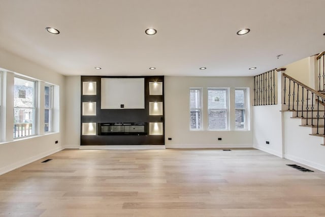 7716 S Rhodes Ave, Chicago, IL 60619 - unfurnished living room featuring stairway, recessed lighting, and light wood-type flooring