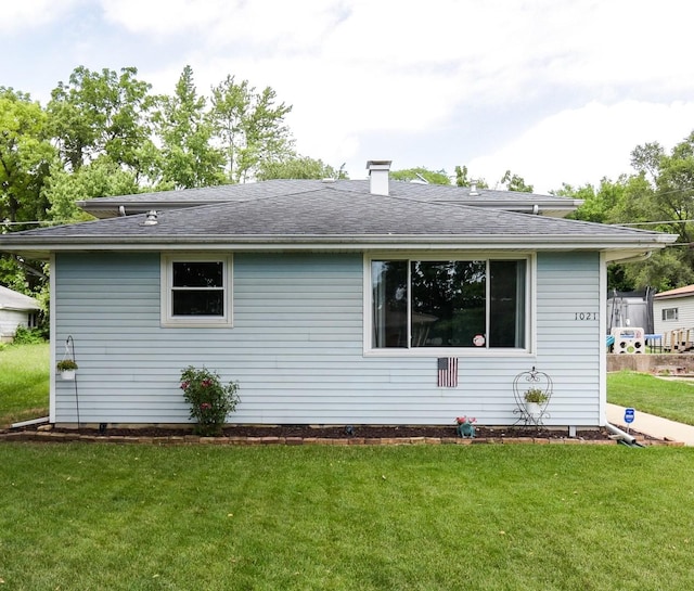 1021 Otis Ave, Rockdale, IL 60436 - rear view of house with a lawn, roof with shingles, and a chimney
