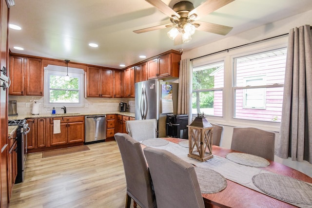 1021 Otis Ave, Rockdale, IL 60436 - kitchen with stainless steel appliances, light wood-style flooring, tasteful backsplash, brown cabinetry, and recessed lighting