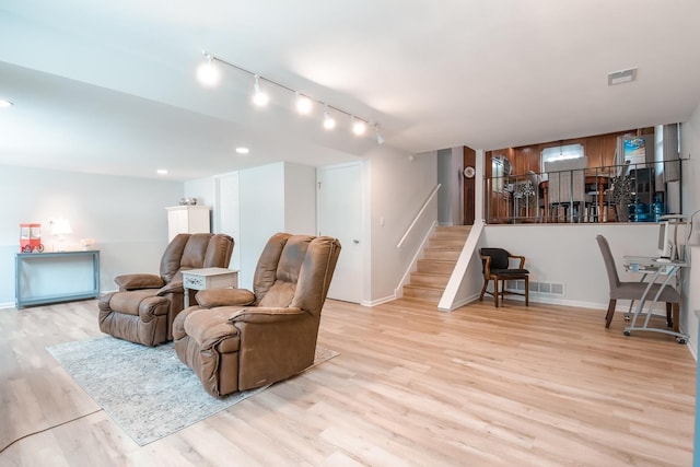 1021 Otis Ave, Rockdale, IL 60436 - living area with stairway, light wood-type flooring, rail lighting, and recessed lighting