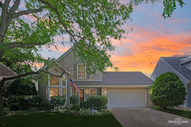 872 Shady Ln, Aurora, IL 60506 - traditional home with concrete driveway, a garage, a shingled roof, and a lawn