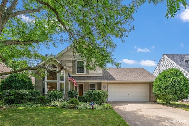 872 Shady Ln, Aurora, IL 60506 - traditional home with a garage, concrete driveway, a front yard, and roof with shingles
