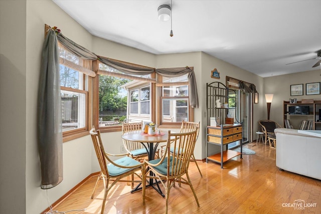 872 Shady Ln, Aurora, IL 60506 - dining space featuring light wood-style flooring and ceiling fan