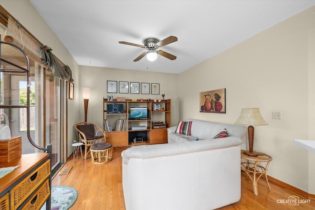 872 Shady Ln, Aurora, IL 60506 - living area featuring a ceiling fan and wood finished floors