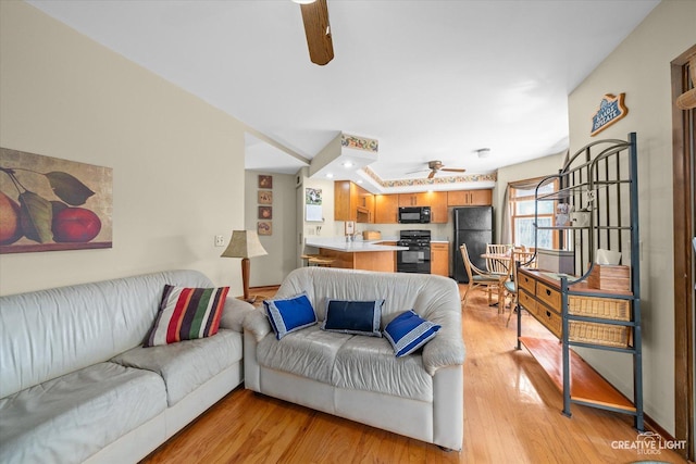872 Shady Ln, Aurora, IL 60506 - living area featuring ceiling fan and light wood-type flooring