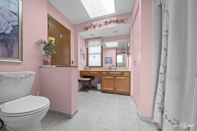 872 Shady Ln, Aurora, IL 60506 - full bath featuring a skylight, vanity, tile patterned floors, and a shower with curtain