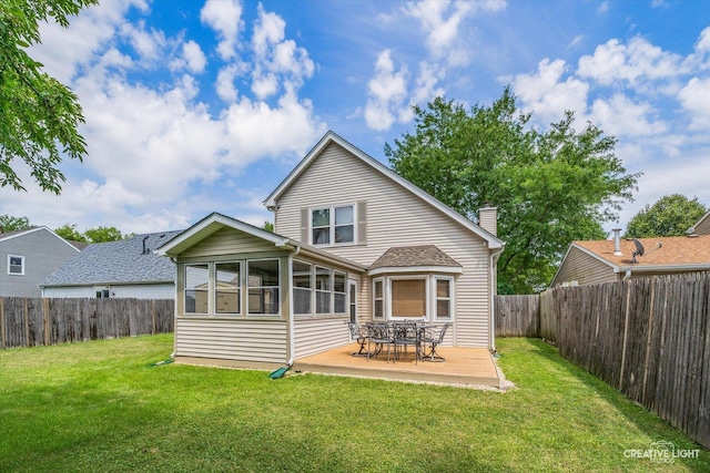872 Shady Ln, Aurora, IL 60506 - rear view of property with a fenced backyard, a deck, a chimney, and a sunroom