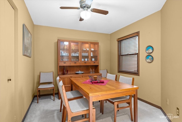 872 Shady Ln, Aurora, IL 60506 - dining room with light colored carpet and a ceiling fan